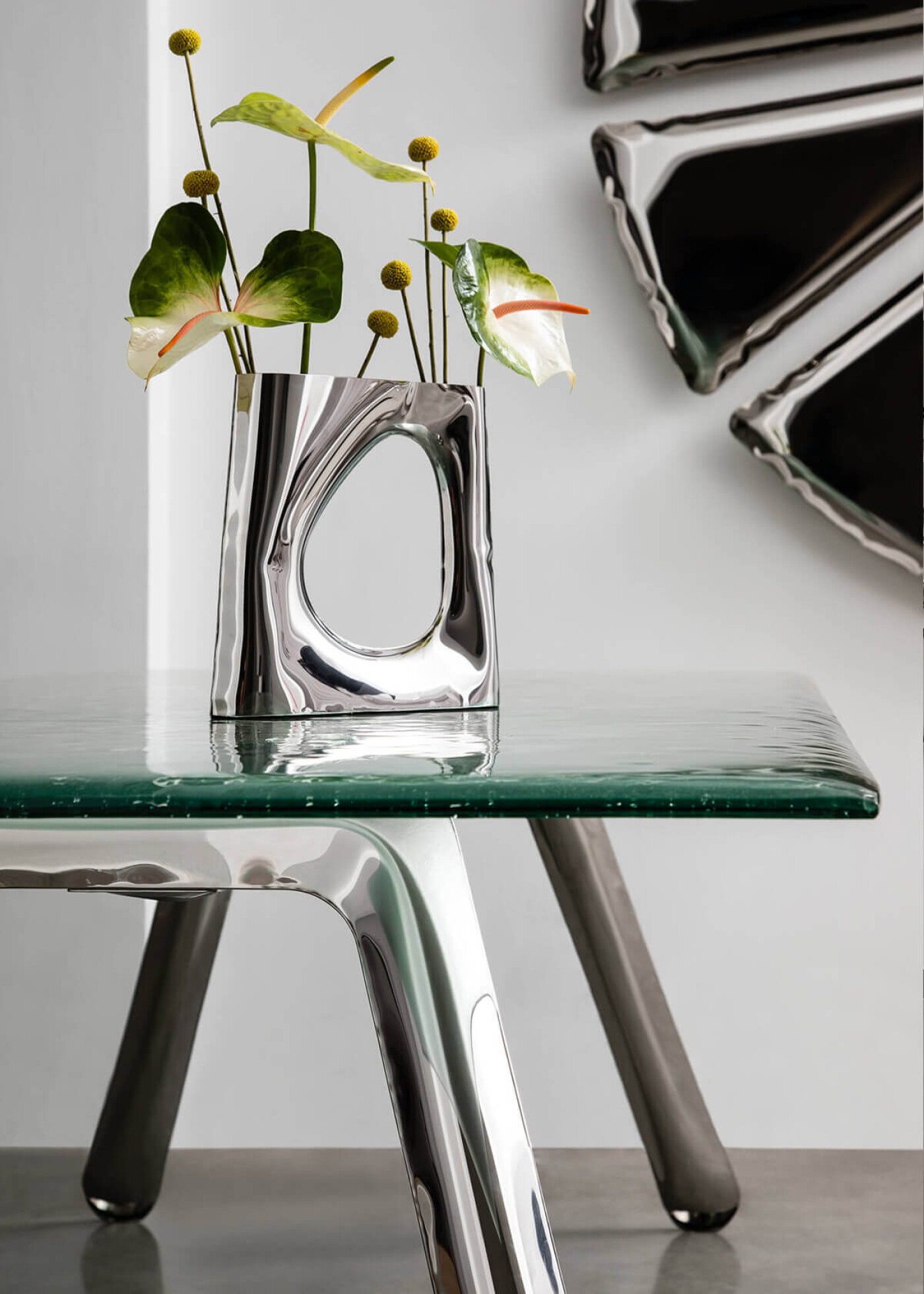 Zieta_KARAVA_VASE_inox_polished_NOGI_table_construction_inox_polished_NUCLEUS_inox_polished_Zieta_Collection_photo_by_Weronika_Trojanowska
