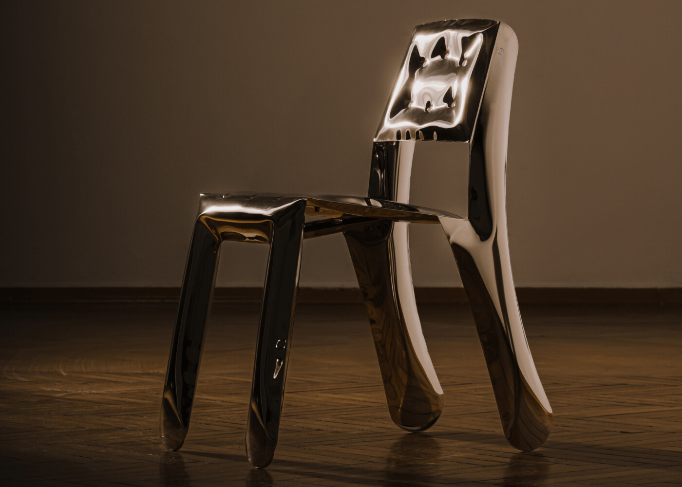 a chippensteel chair shining and reflecting light 