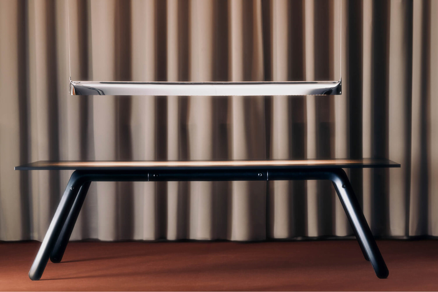Zieta Studio, Blade Lamp in polished inox finish, Ultraleggera Table in anodic black, sculptural lighting, modern dining furniture, minimalist interior design, contemporary stainless steel lamp, designer table setup