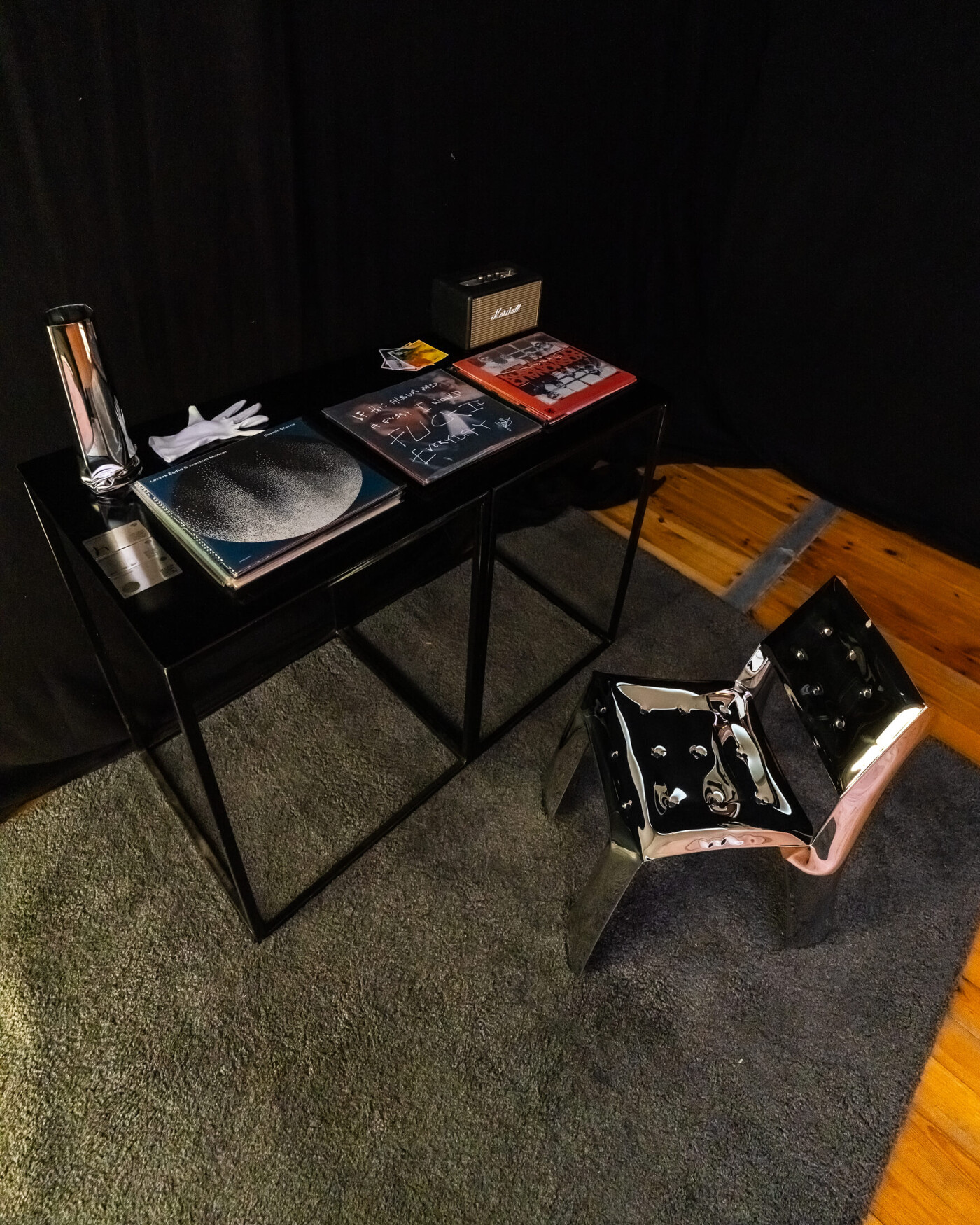 Crash vase and Chippensteel chair by Zieta Studio made of inflated polished stainless steel in a modern interior