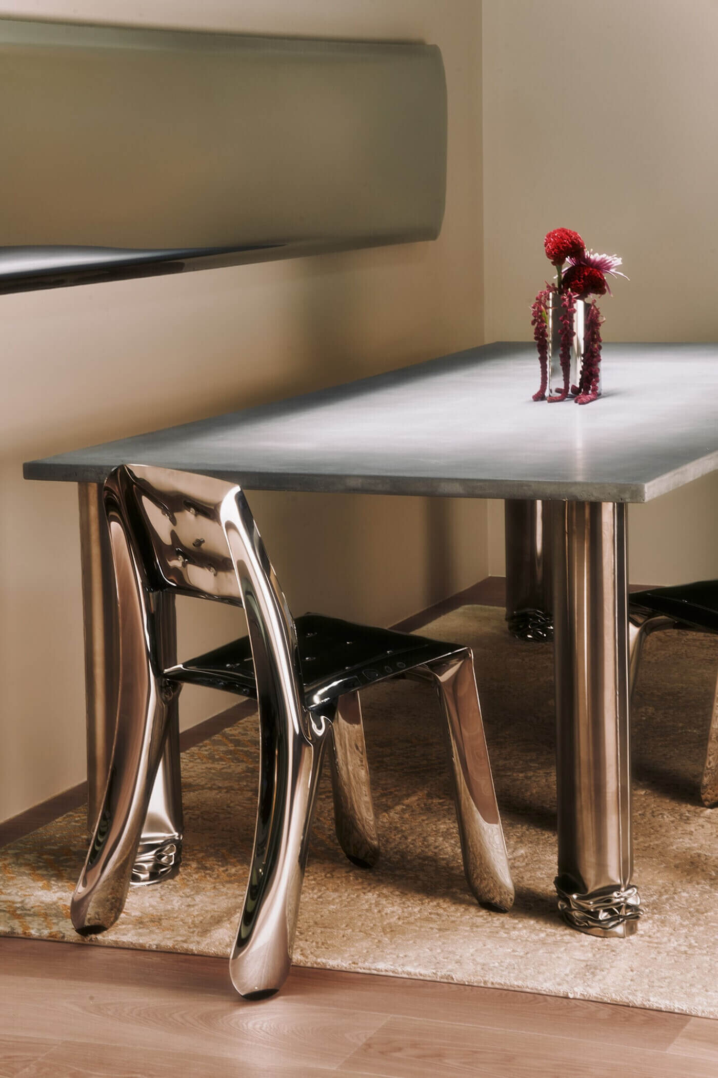 zieta crash table with chippensteel chair in interior