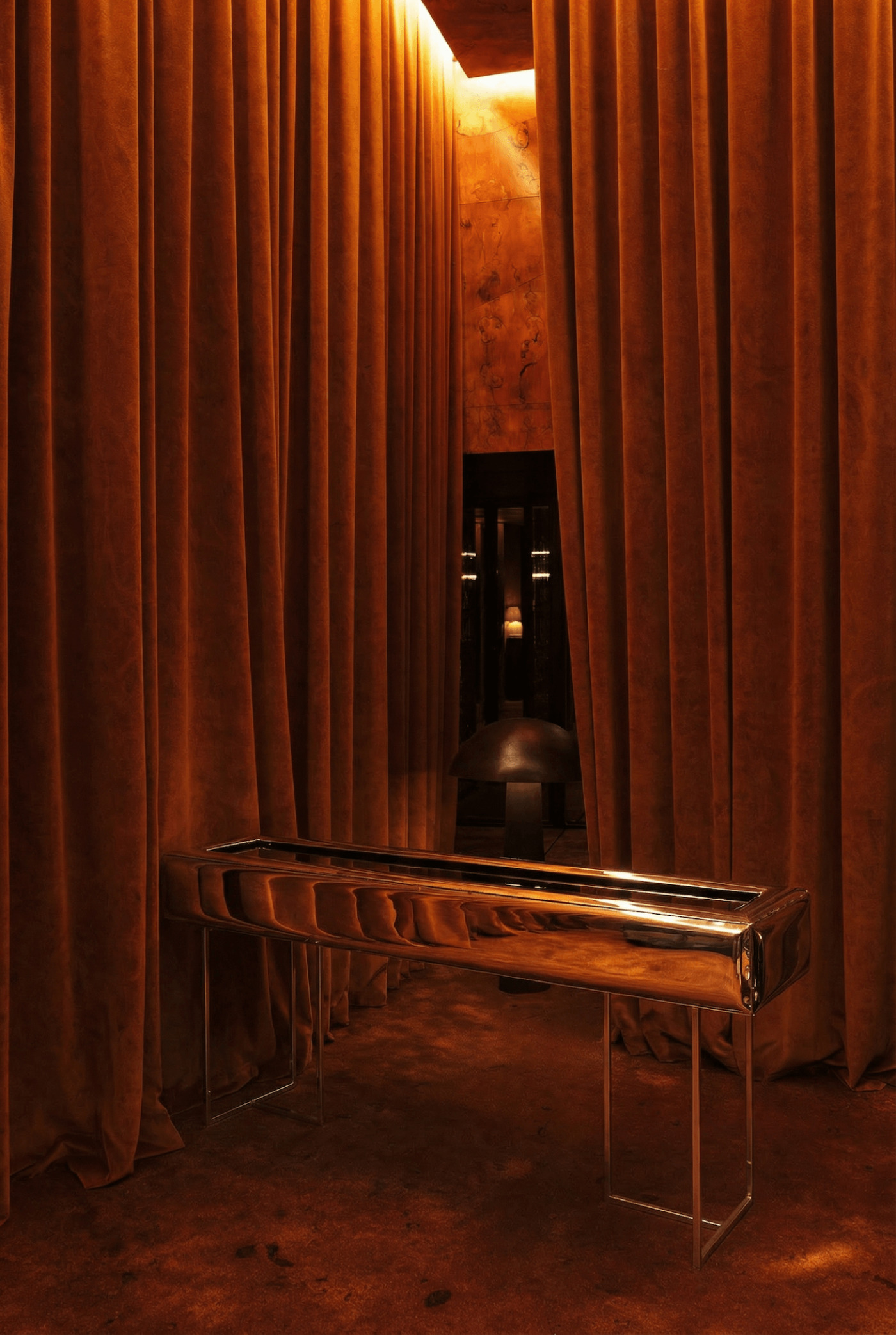 zieta studio sejv in a warm, orange toned background with curtains