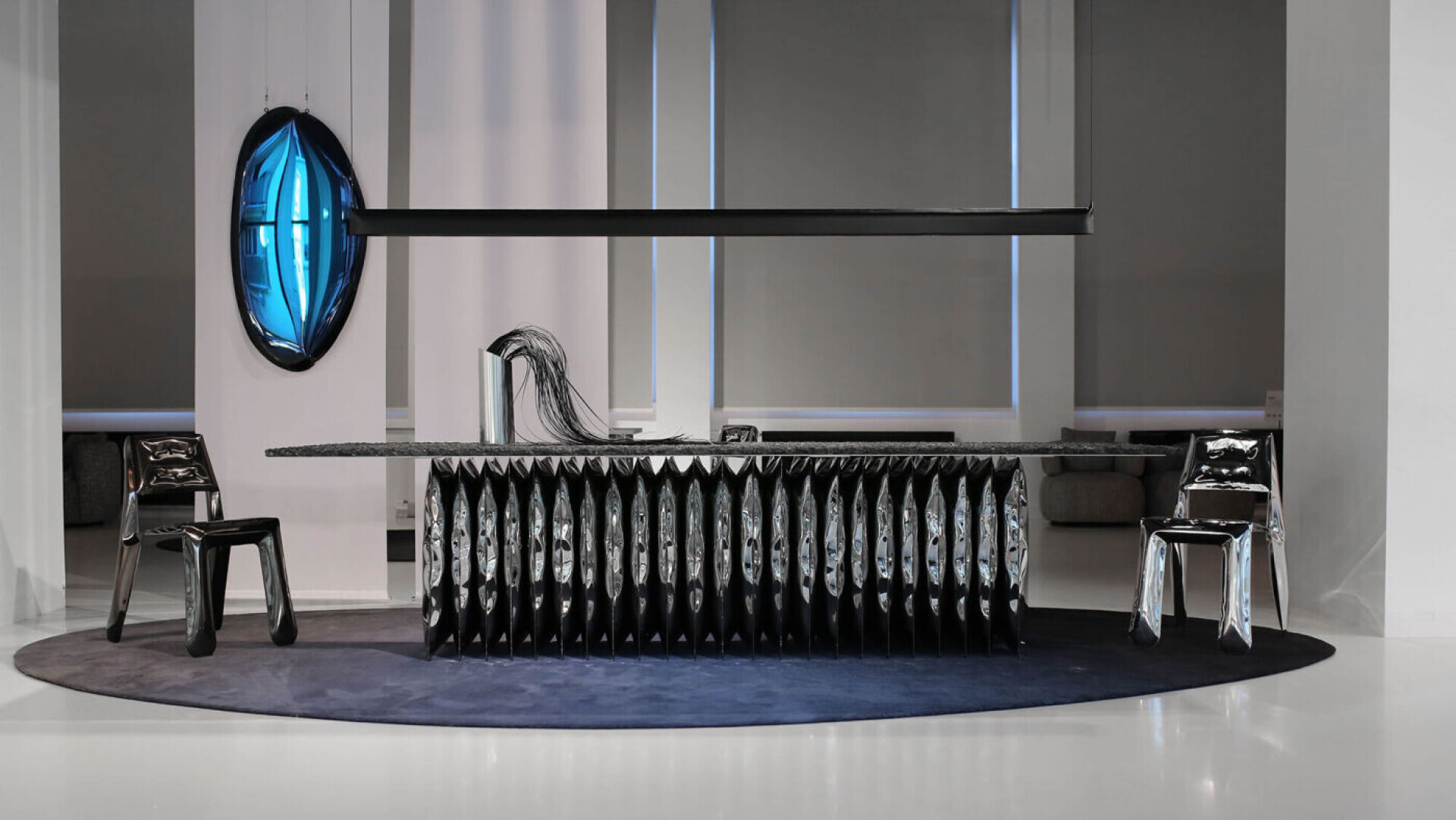 zieta harmonica table standing on the deep space blue wool transitions rug