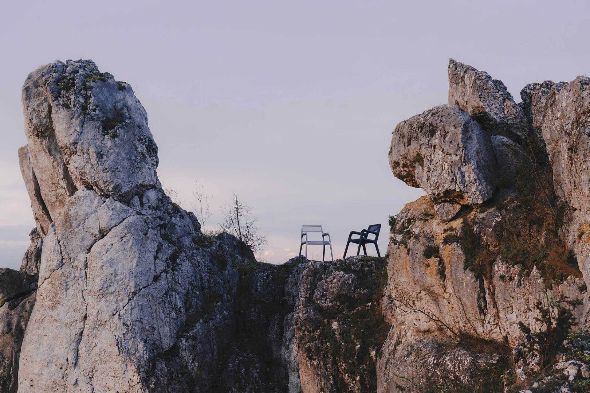 zieta ultraleggera arm chair on top of a mountain cliff