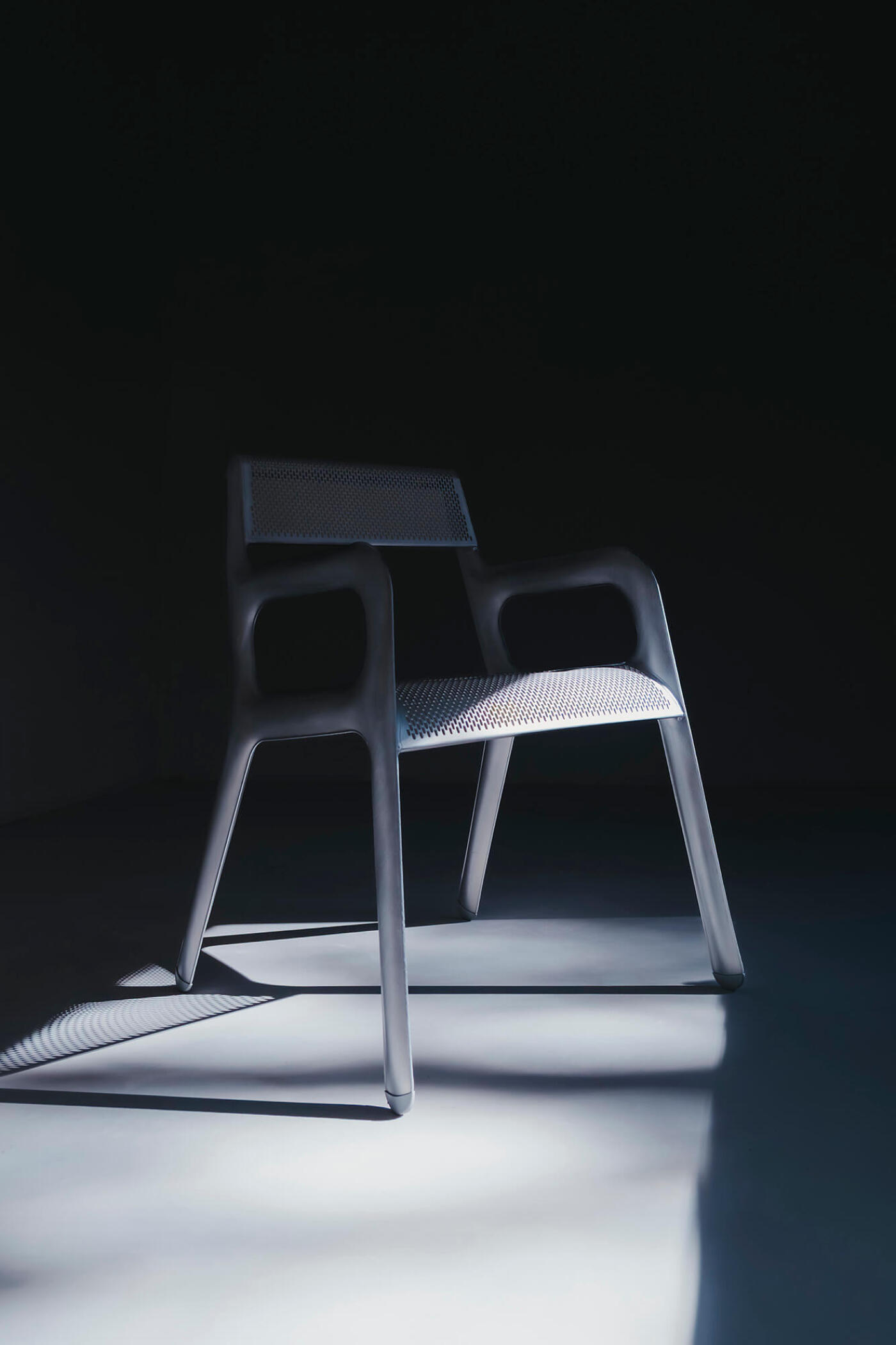 Ultraleggera Arm Chair in a contrast lighting