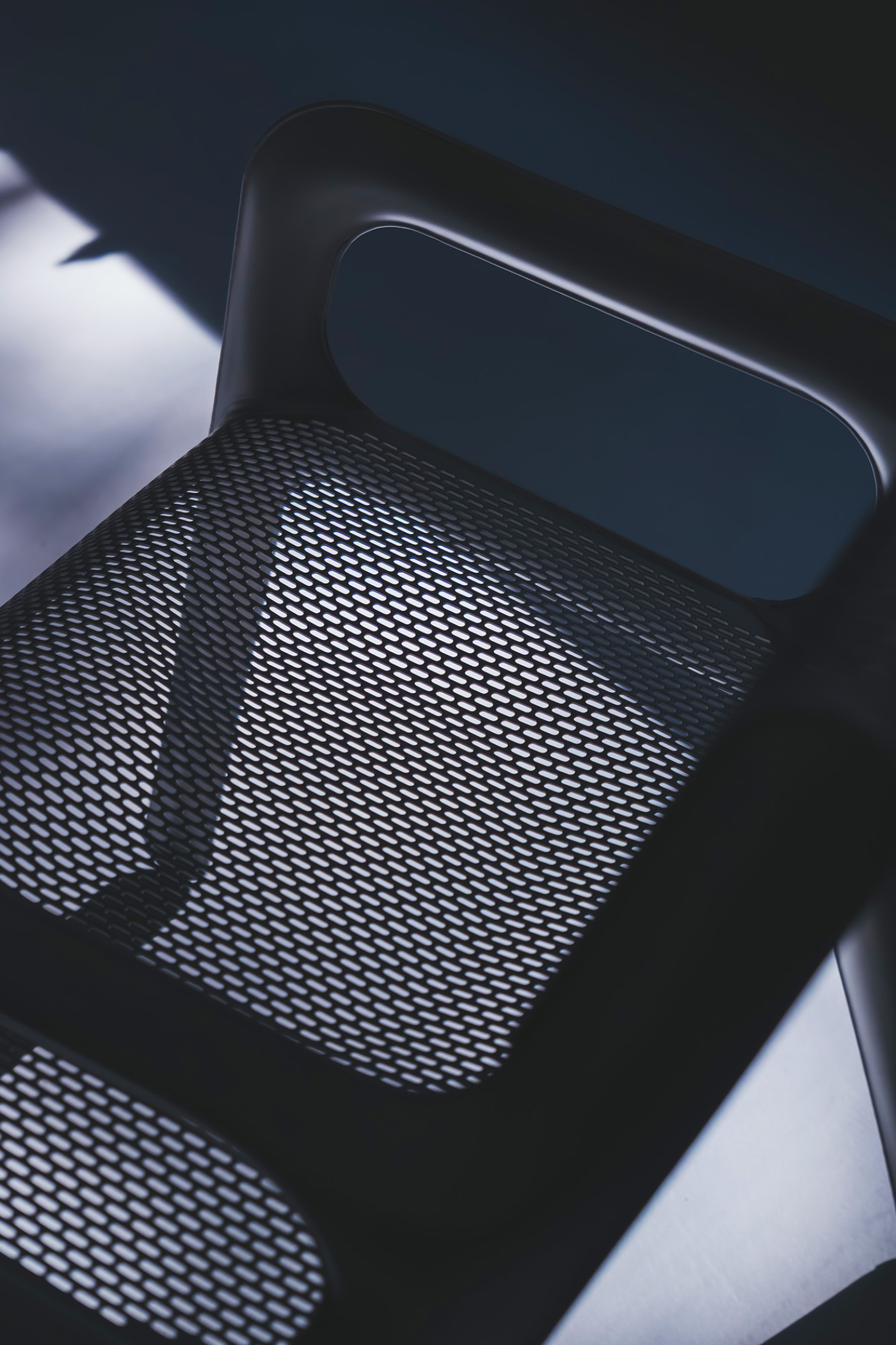 Ultraleggera Arm Chair in a contrast lighting