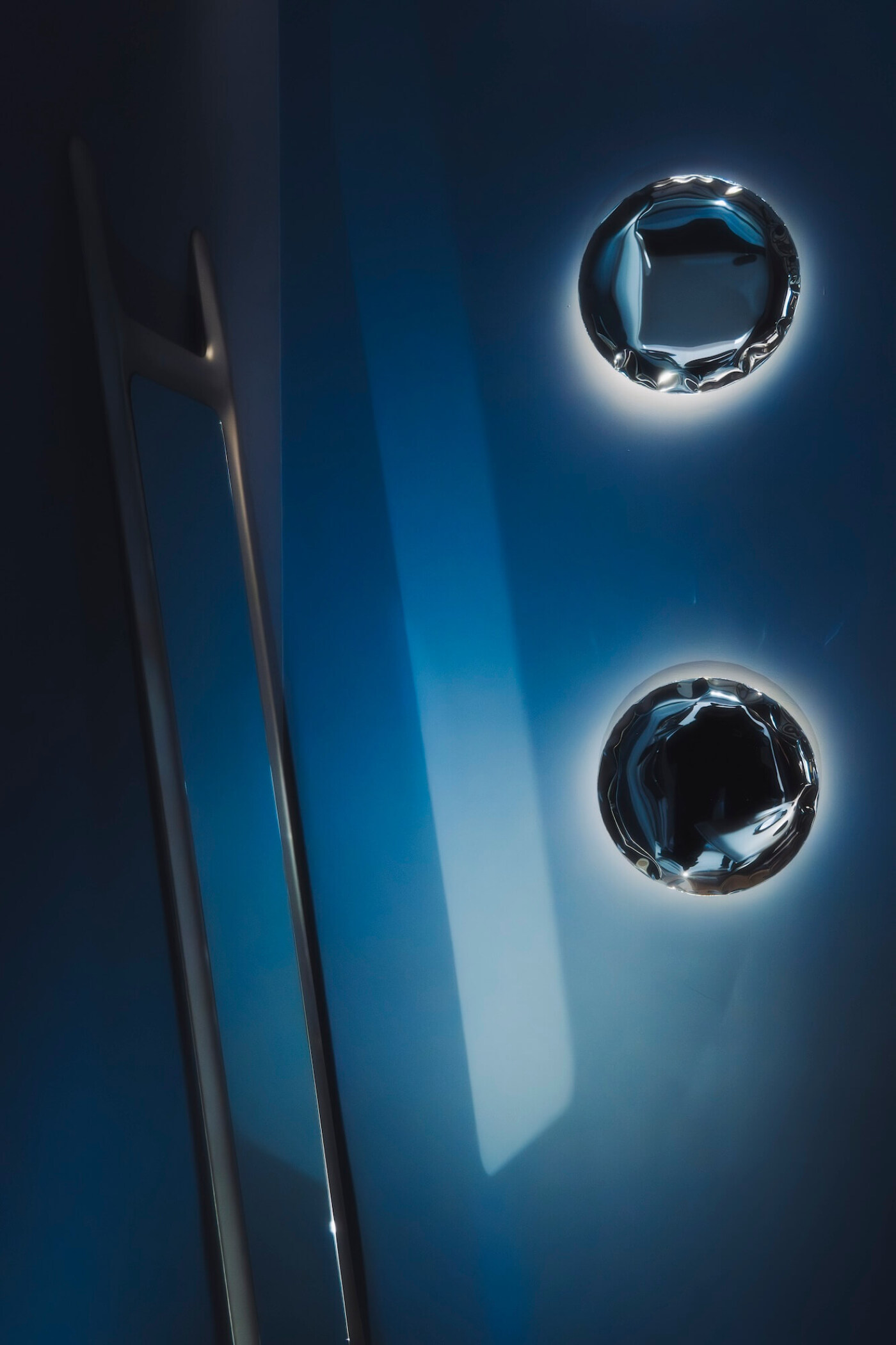 zieta two kin wall lamps on a blue background 