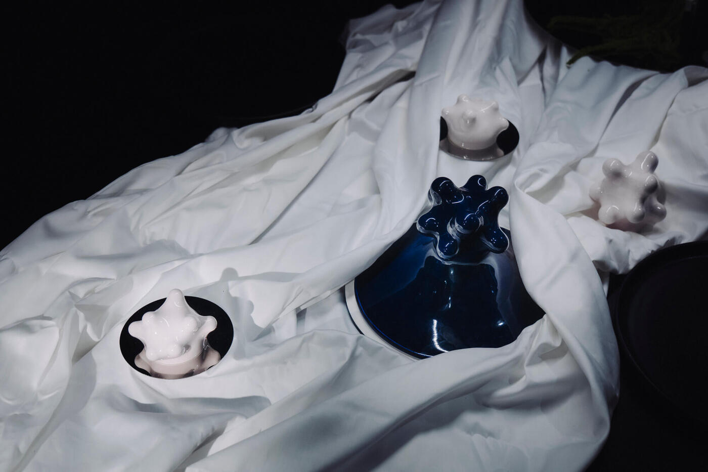 arkadiusz szwed ceramics on a white cloth