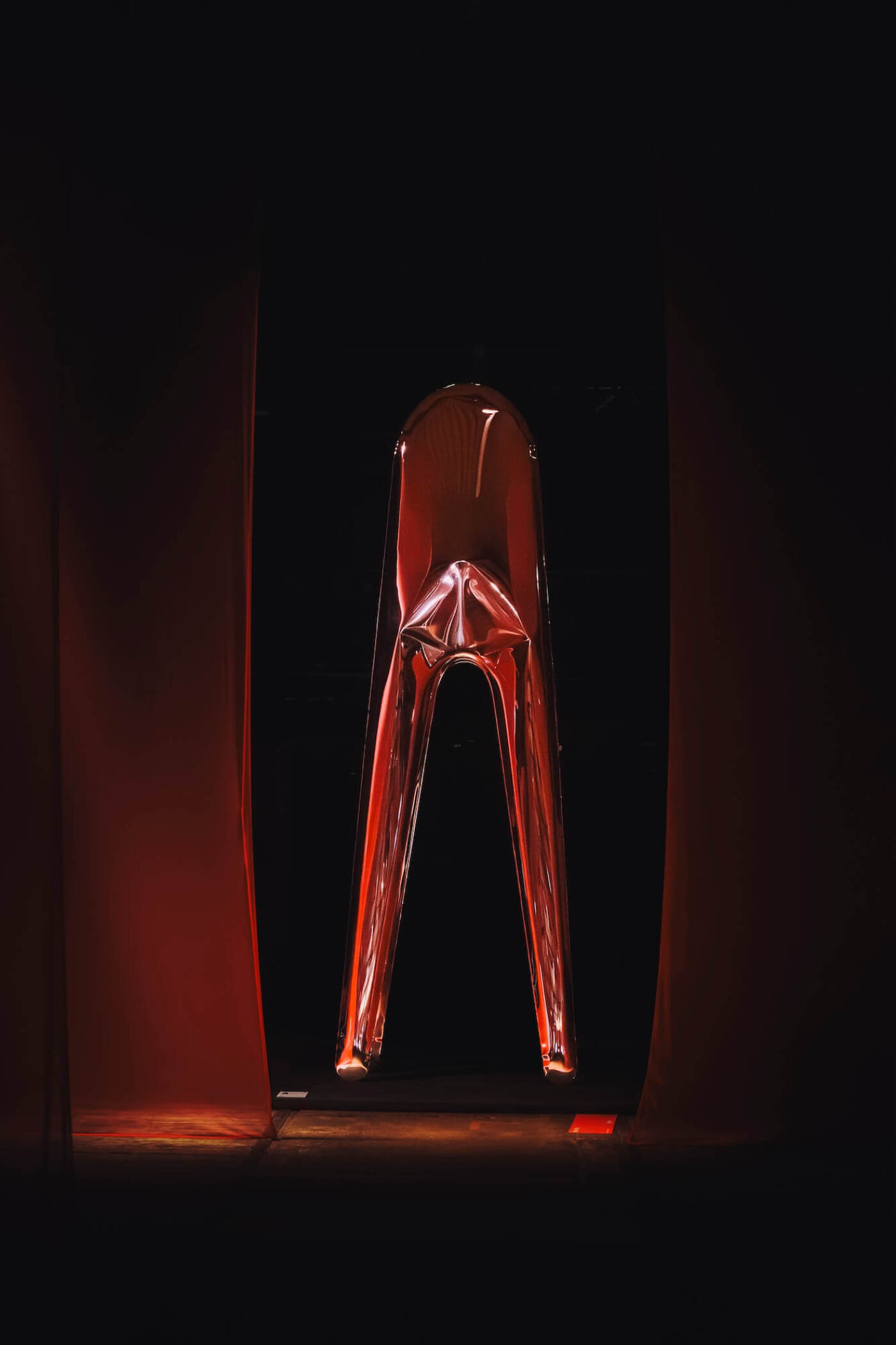 zieta cyclops sculpture in a dark room illuminated by soft ligh