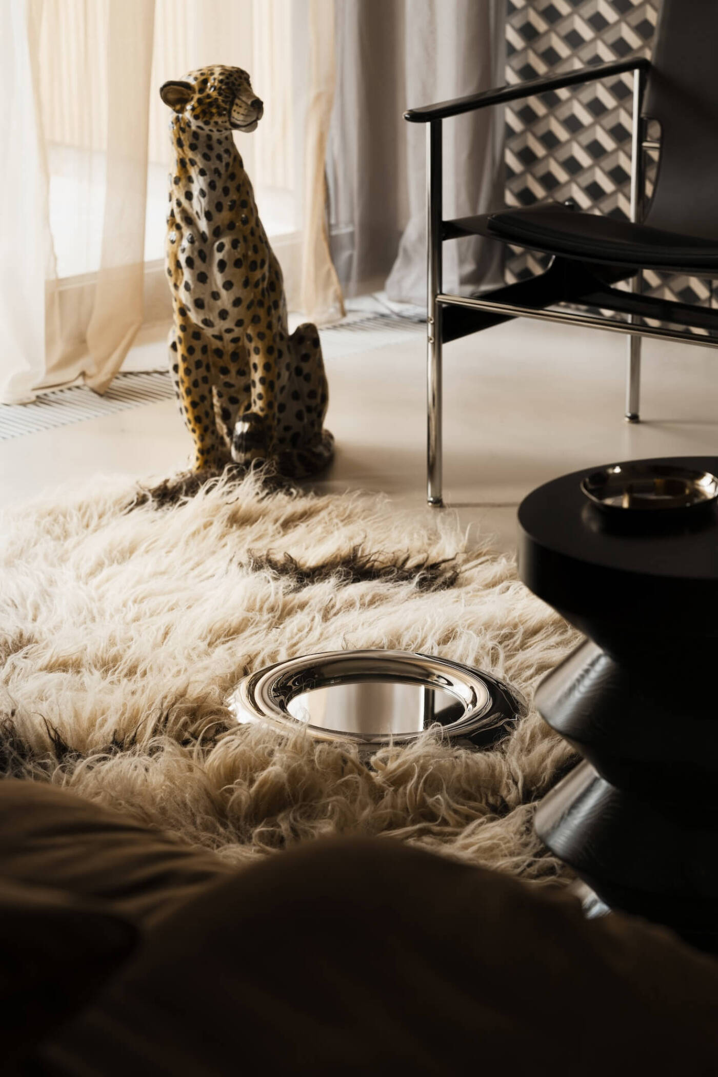 zieta rondel mirror laying on a fluffy carpet