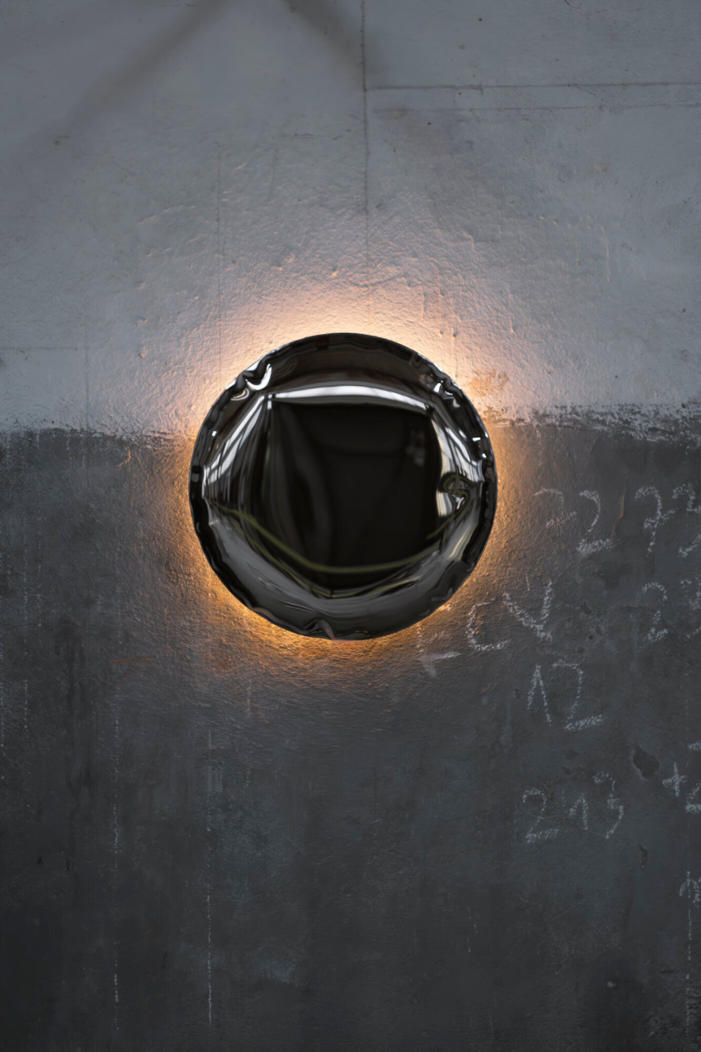 zieta kin lamp on a concrete wall