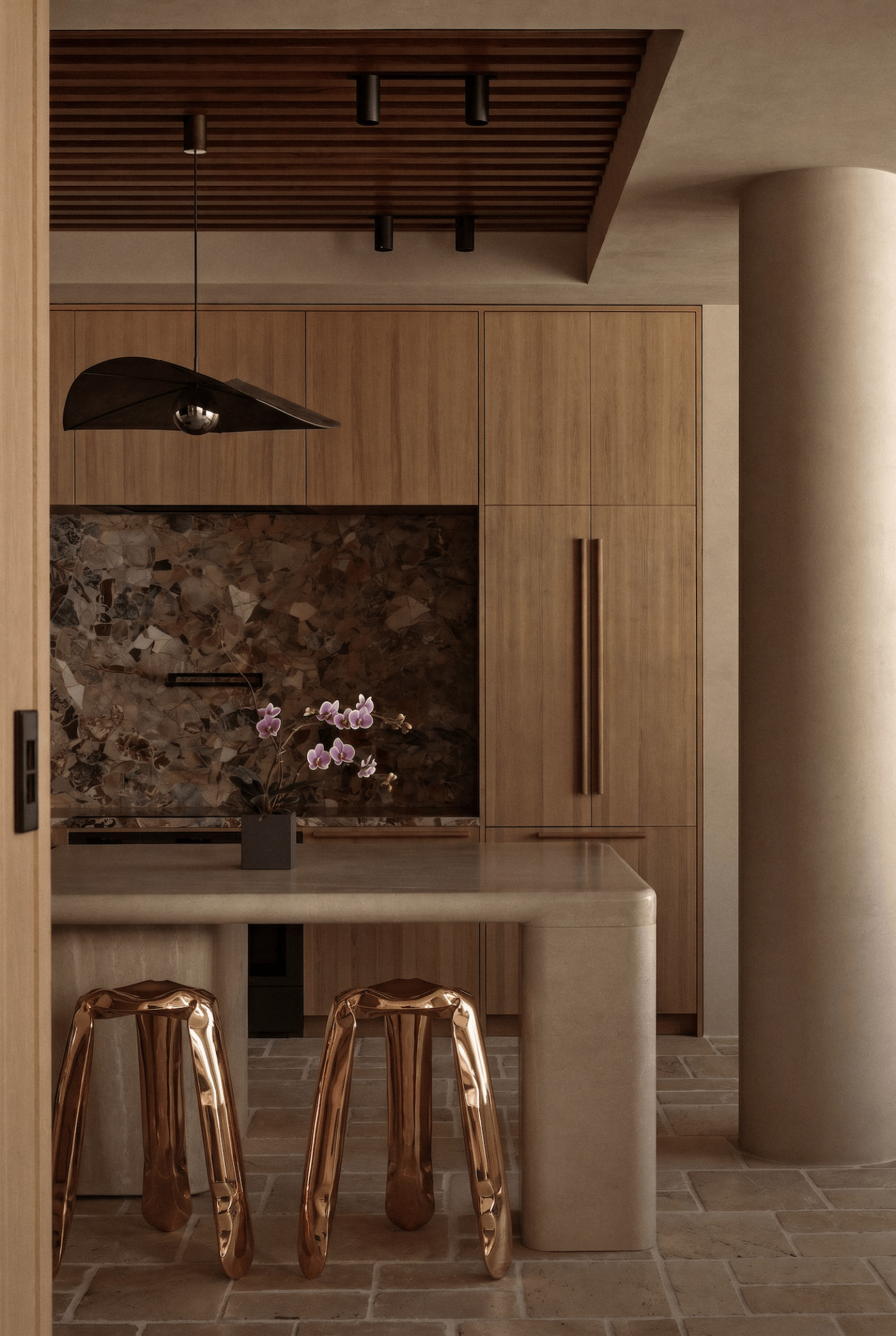 two plopp kitchen flamed gold stools in a beige moody kitchen