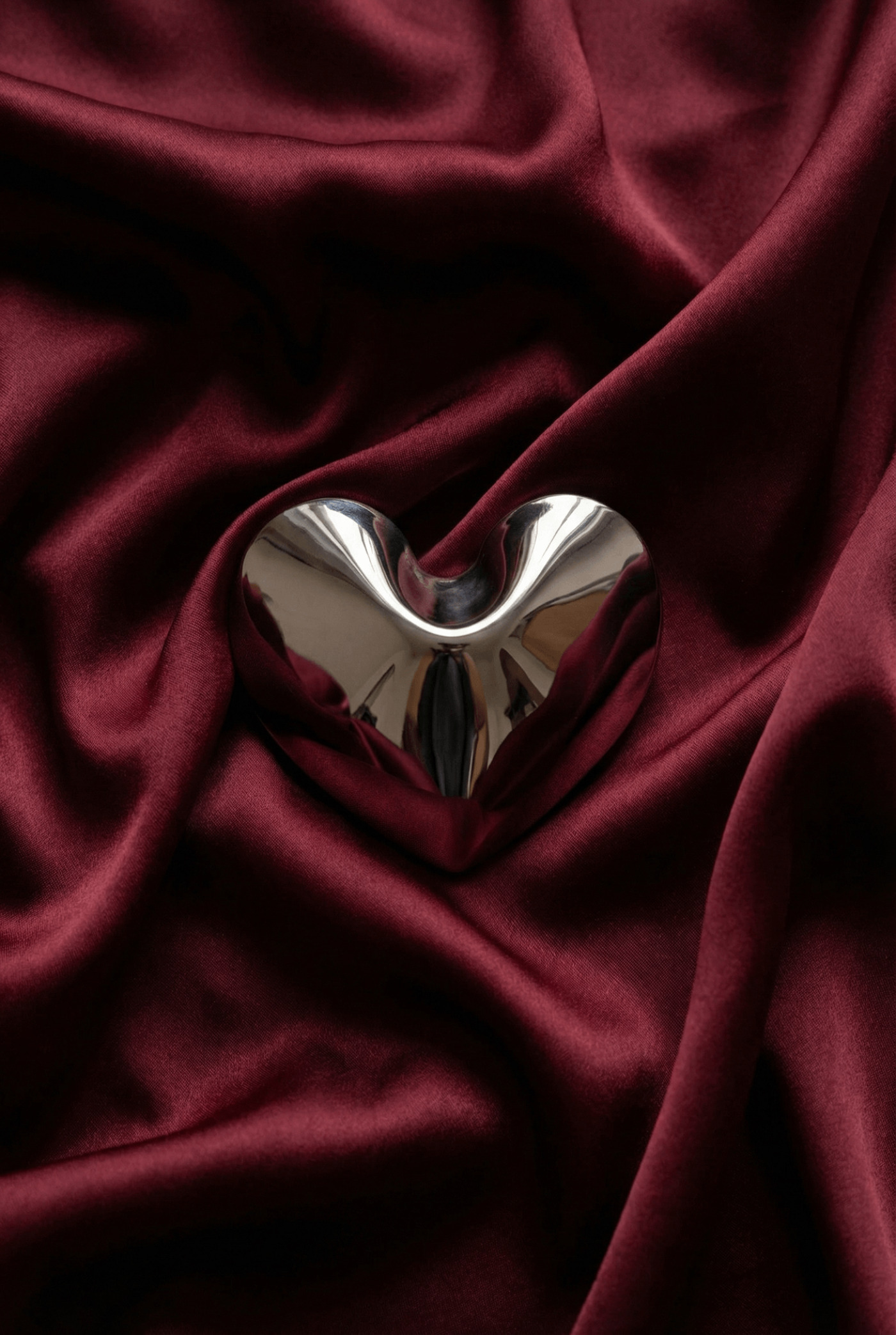 zieta hot heart laying in a red material