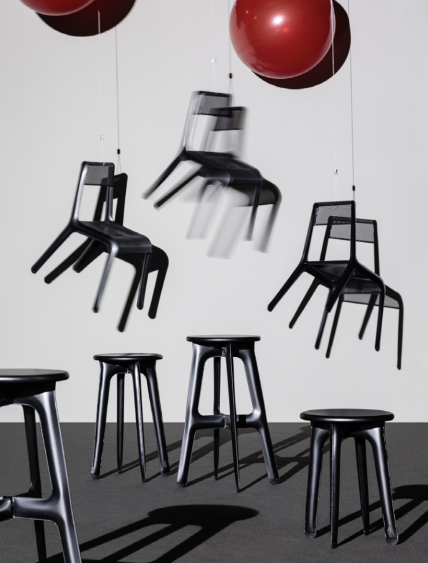 zieta ultralight ultraleggera chairs attached to red baloons