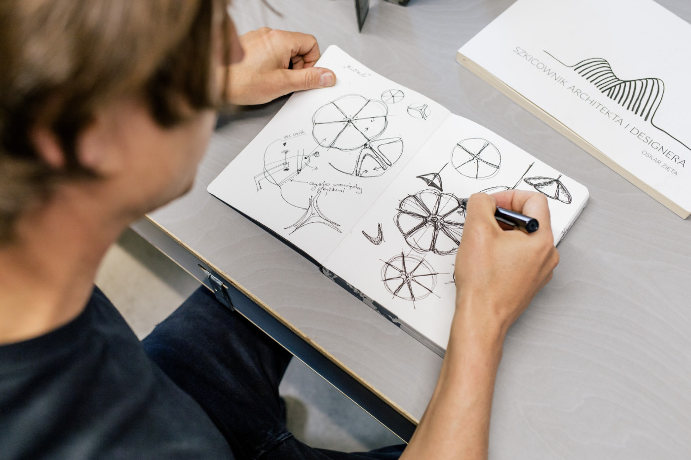 oskar zieta sketching his ideas