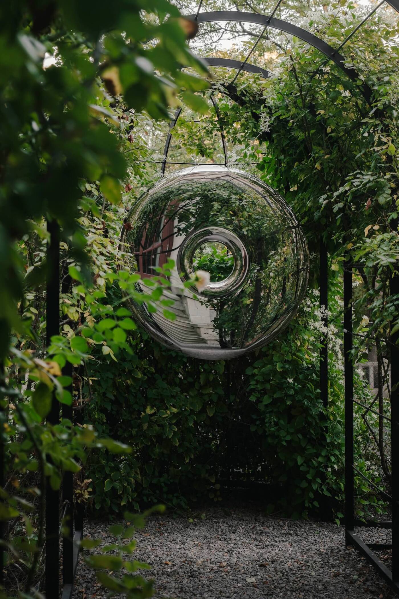 zieta studio rondo mirror in a garden 